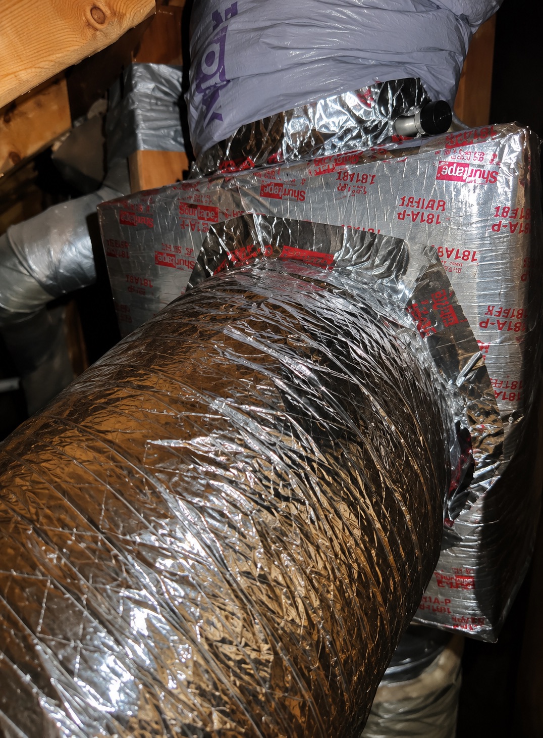Final sealed duct transition with flex duct connected to supply conditioned air to the added room.