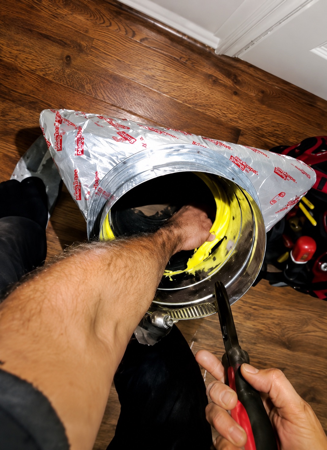 Cutting the duct opening for the triangular branch duct transition.