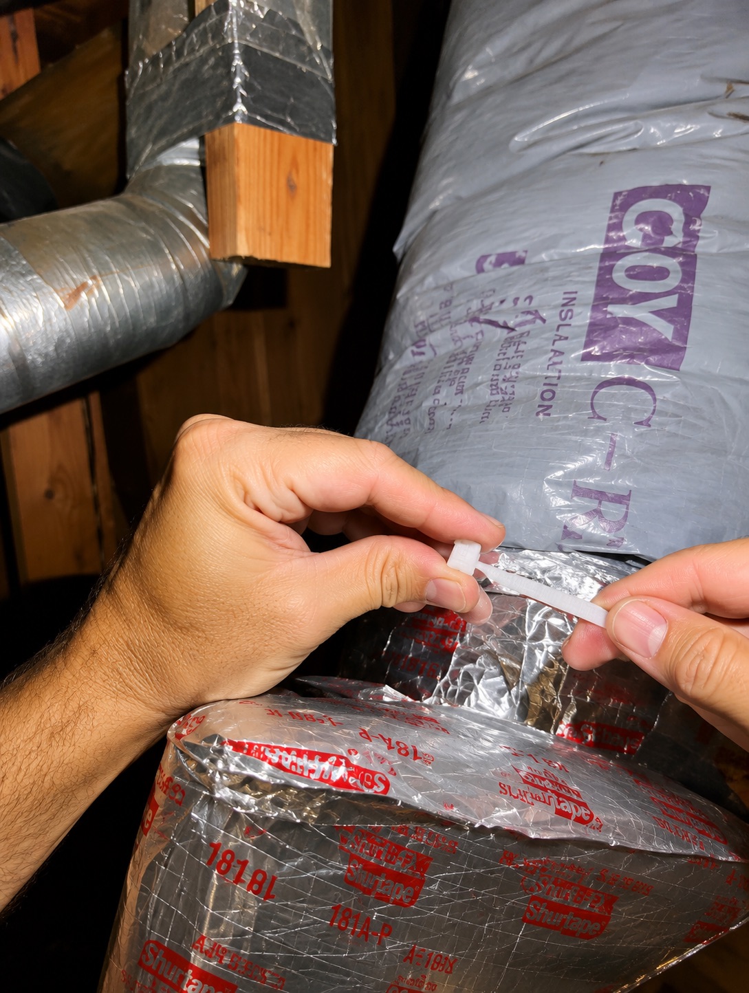 Securing and sealing the duct connection with proper fastening.